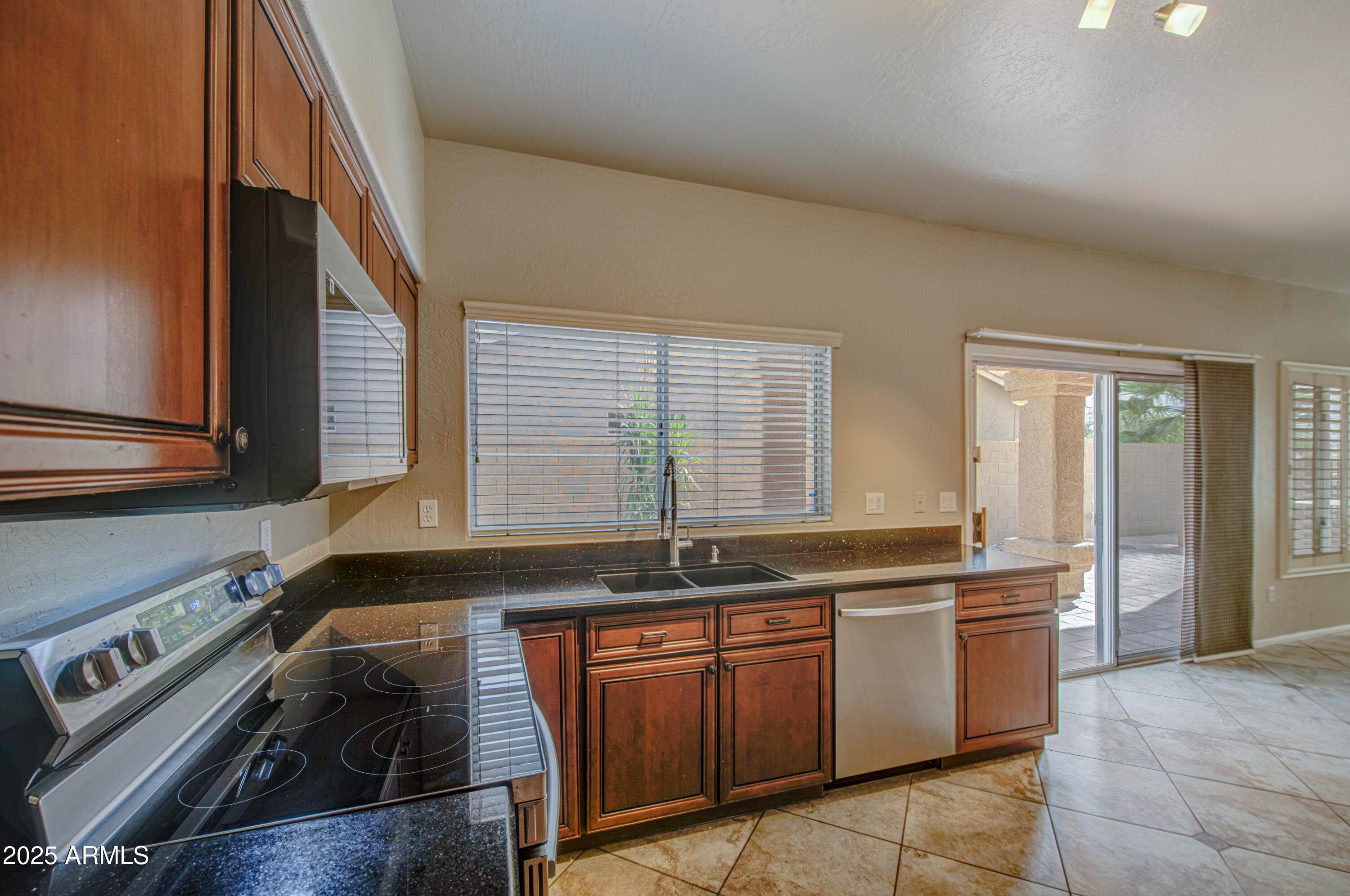 16237 South 13th Street Phoenix, AZ 85048 - Photo 29 of 68 a kitchen with a sink and a stove