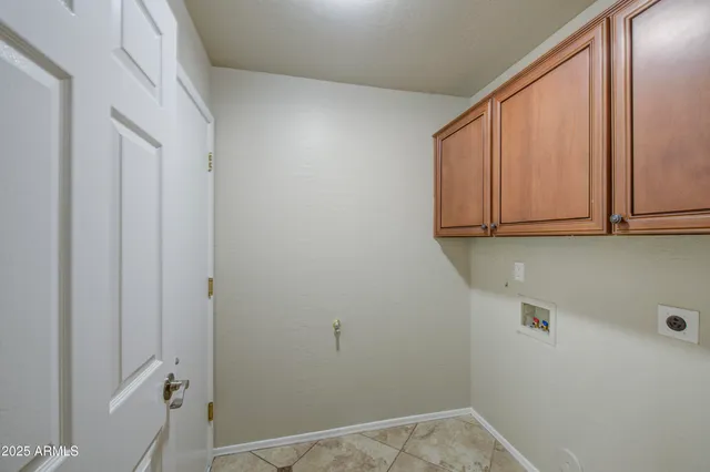 a spacious bathroom with a granite countertop sink a mirror and a shower
