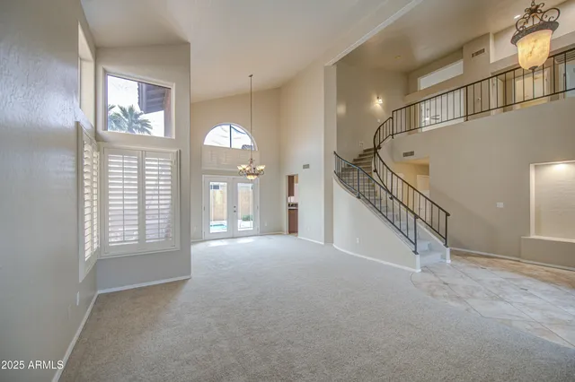 a large bathroom with a tub a sink a large mirror and a shower