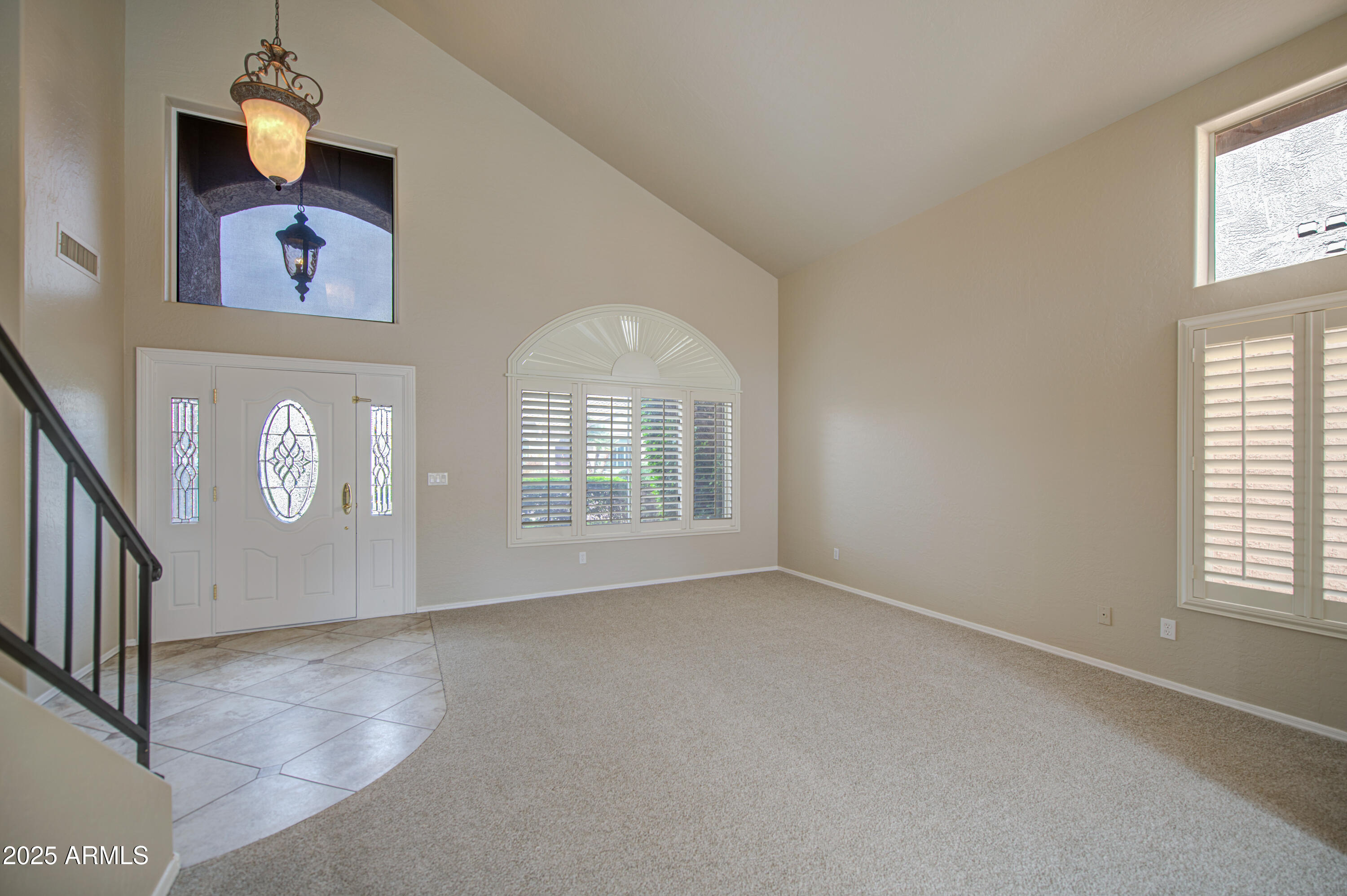 16237 South 13th Street Phoenix, AZ 85048 - Photo 39 of 68 an empty room with windows and fan