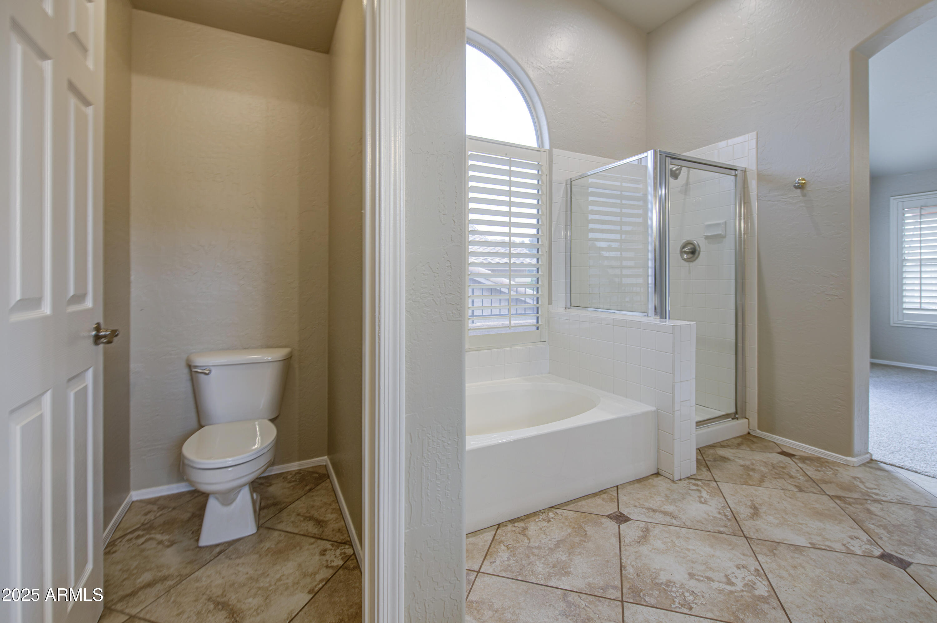 16237 South 13th Street Phoenix, AZ 85048 - Photo 45 of 68 a bathroom with a toilet and a bathtub