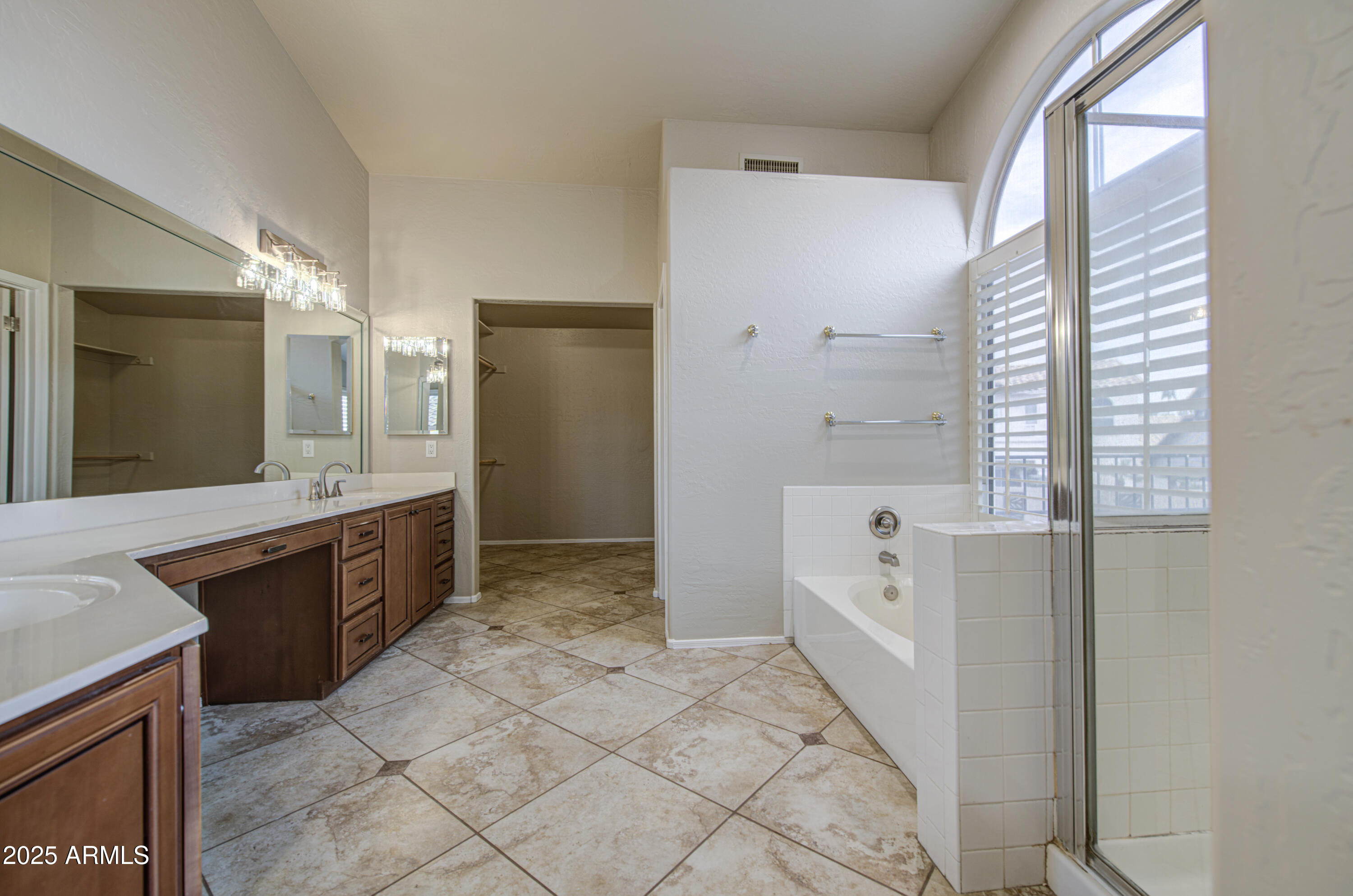 16237 South 13th Street Phoenix, AZ 85048 - Photo 46 of 68 a large bathroom with a tub a sink a large mirror and a shower