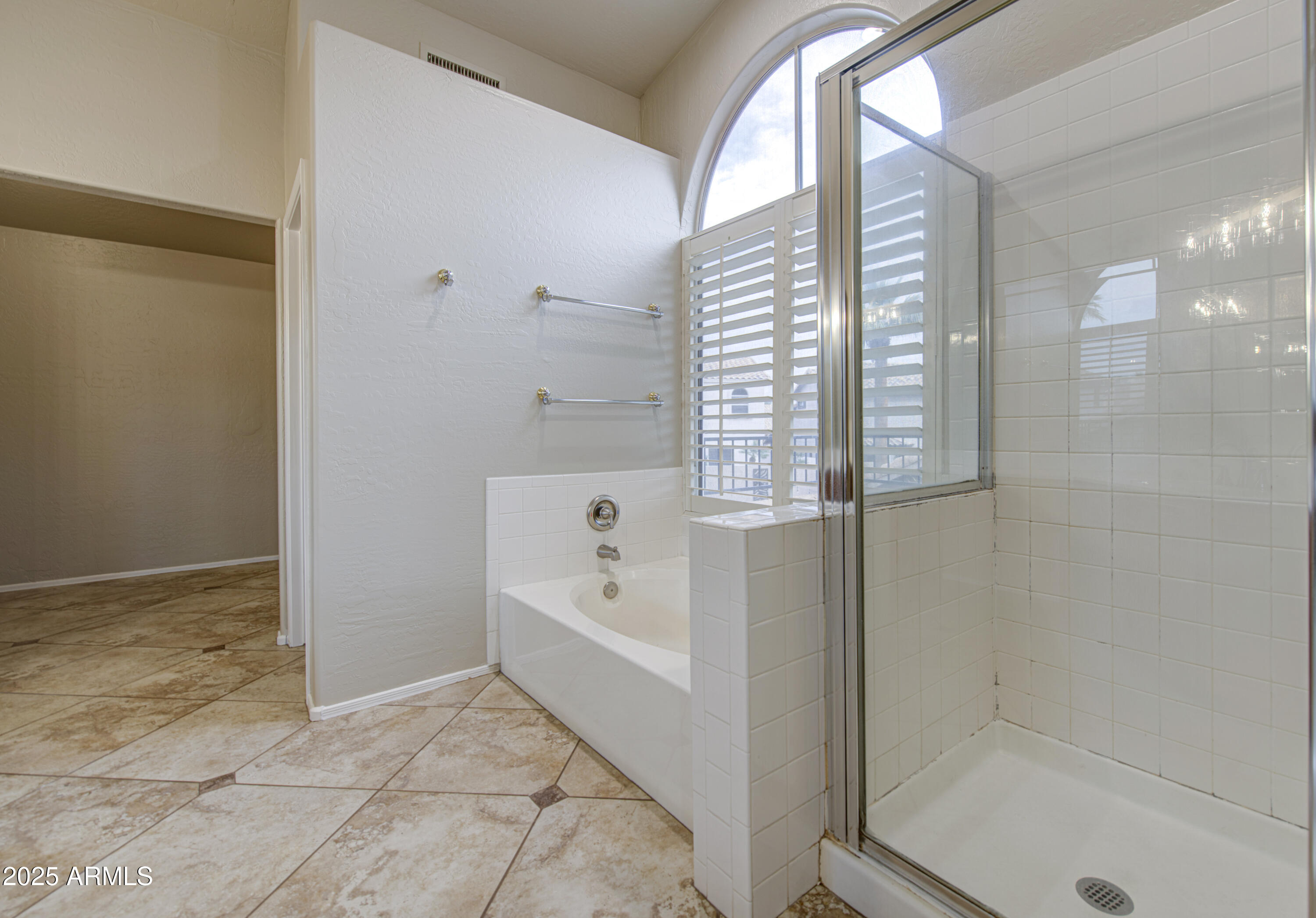 16237 South 13th Street Phoenix, AZ 85048 - Photo 48 of 68 a bathroom with a bathtub and a shower