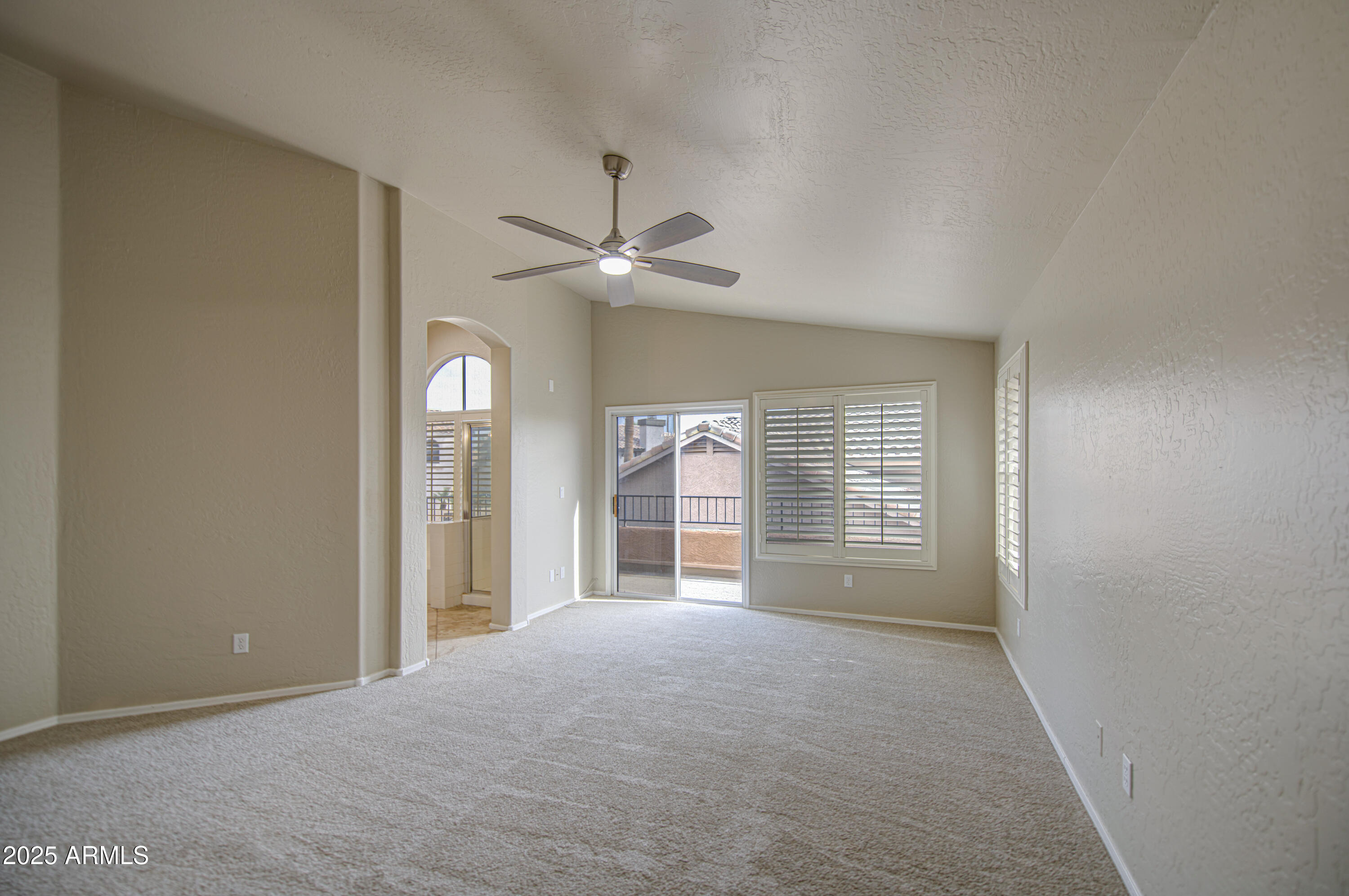 16237 South 13th Street Phoenix, AZ 85048 - Photo 50 of 68 an empty room with windows and fan
