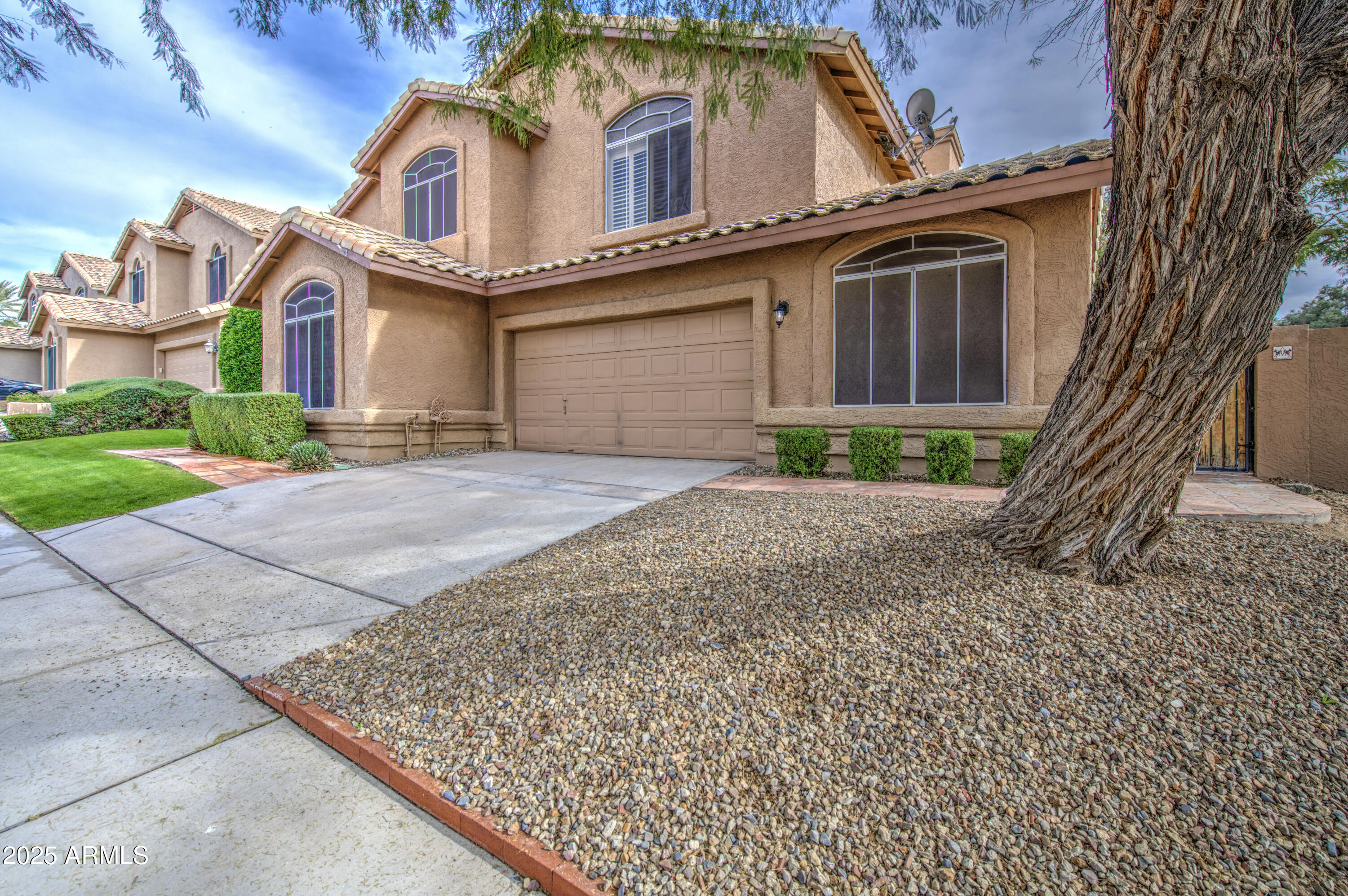 16237 South 13th Street Phoenix, AZ 85048 - Photo 5 of 68 front view of a house with a yard