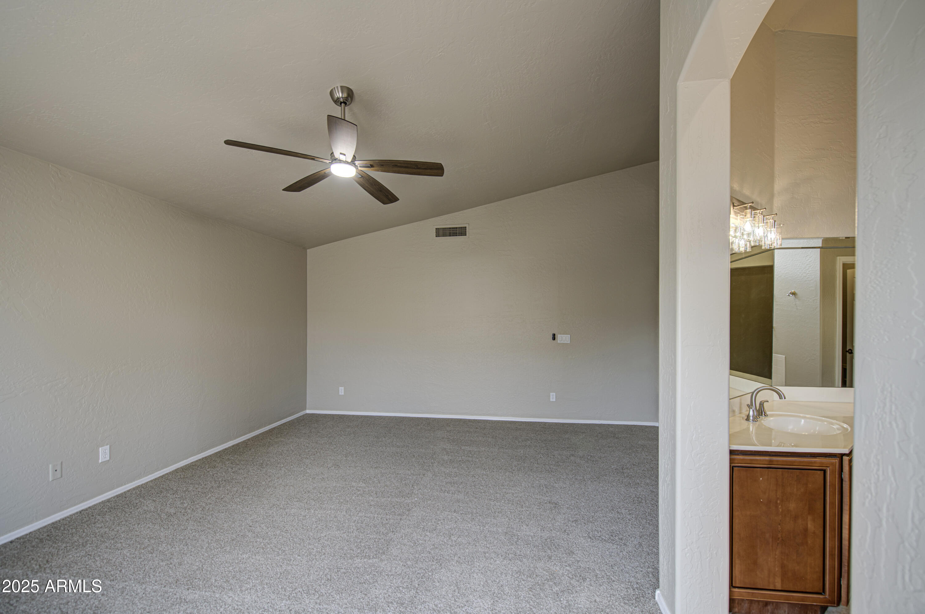 16237 South 13th Street Phoenix, AZ 85048 - Photo 52 of 68 a view of a livingroom with a ceiling fan and a chandelier fan