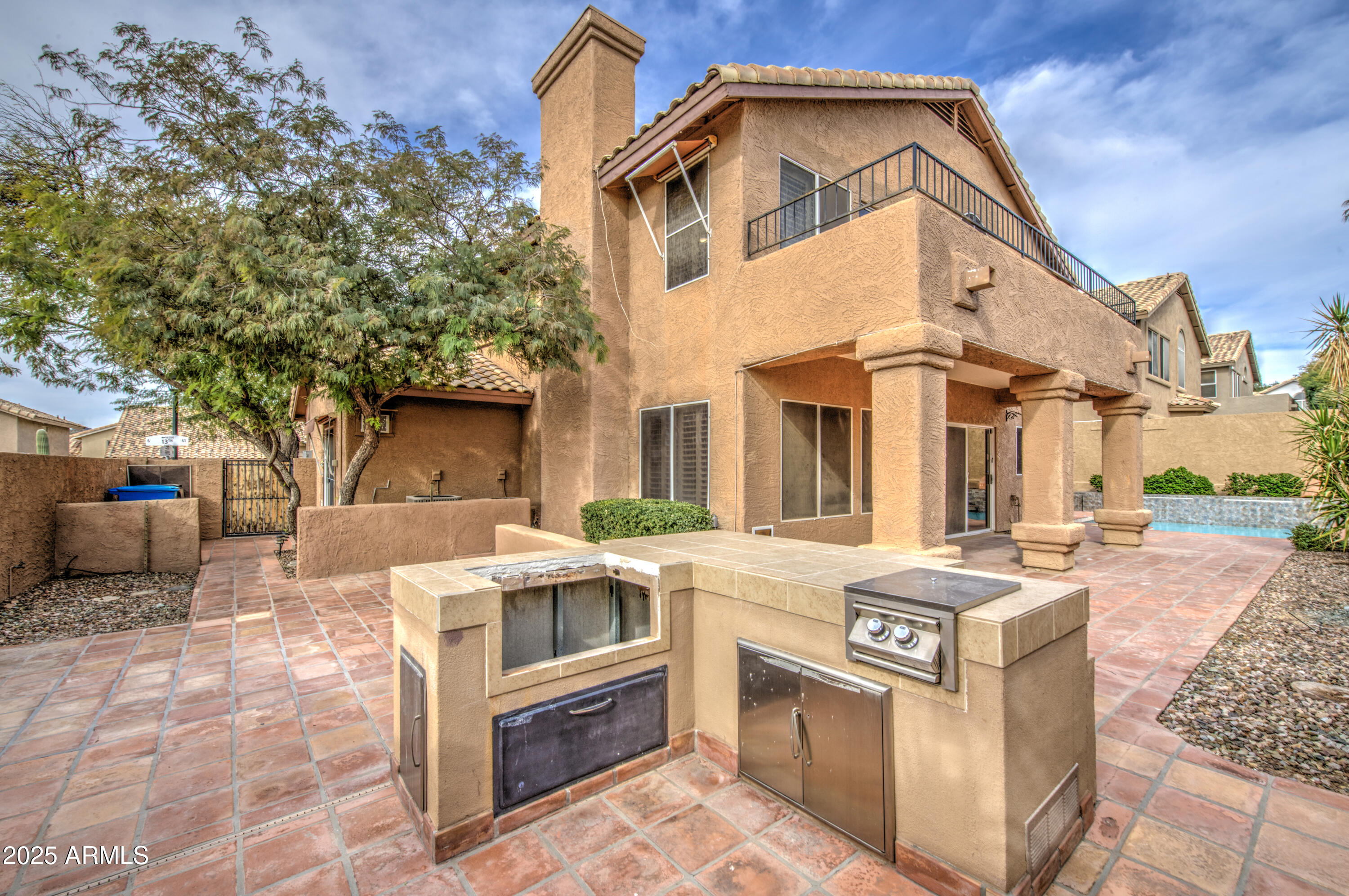 16237 South 13th Street Phoenix, AZ 85048 - Photo 56 of 68 a front view of a house with yard outdoor seating and barbeque oven