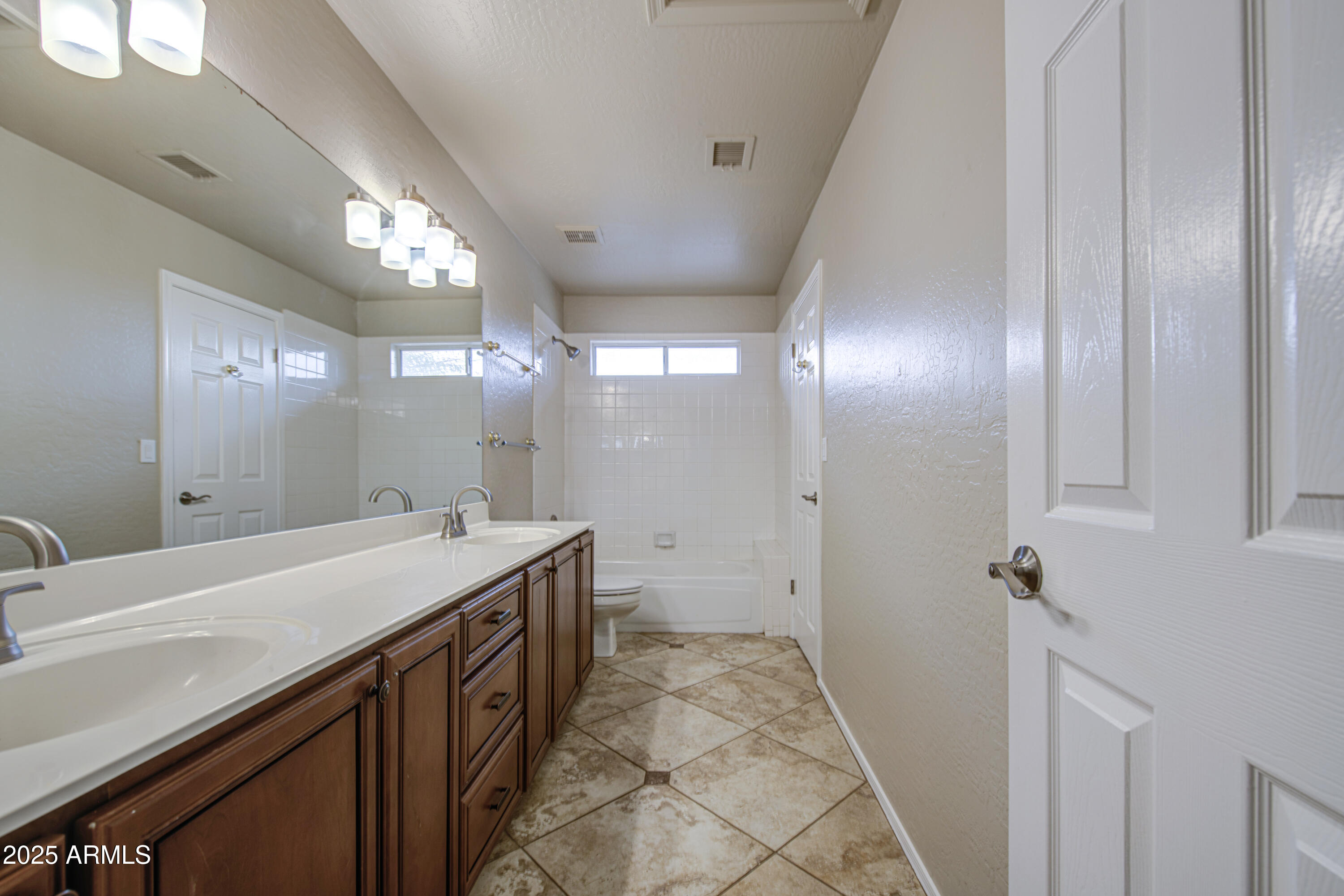 16237 South 13th Street Phoenix, AZ 85048 - Photo 9 of 68 a bathroom with a sink a vanity and a mirror
