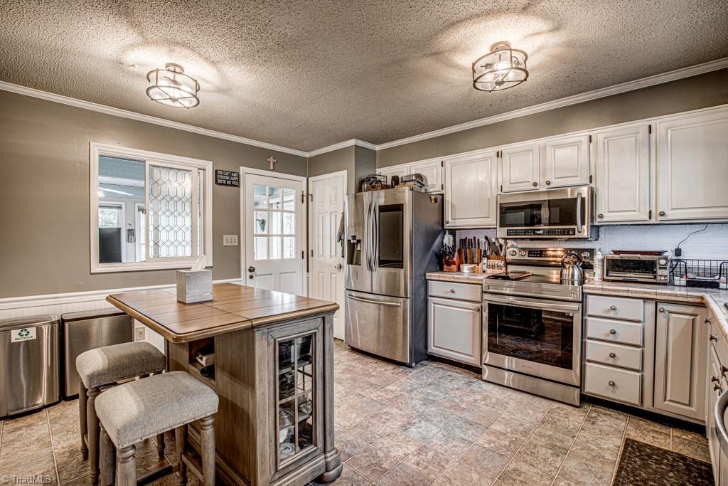 261 Brittany Road Rural Hall, NC 27045 - Photo 5 of 43 Kitchen leads to Sunroom