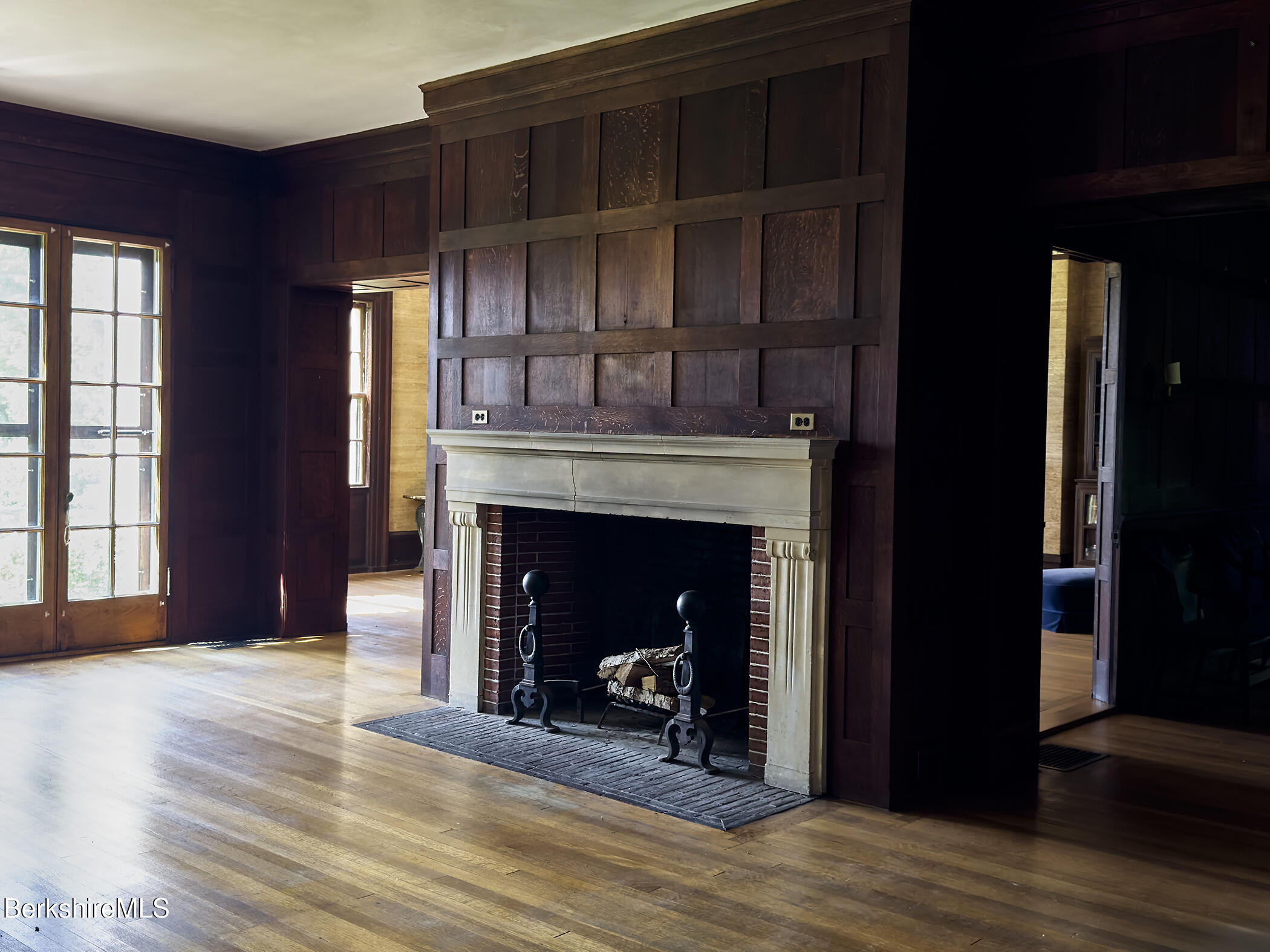 319 Under Mountain Road Lenox, MA 01240 - Photo 13 of 57 a living room with a fireplace in it