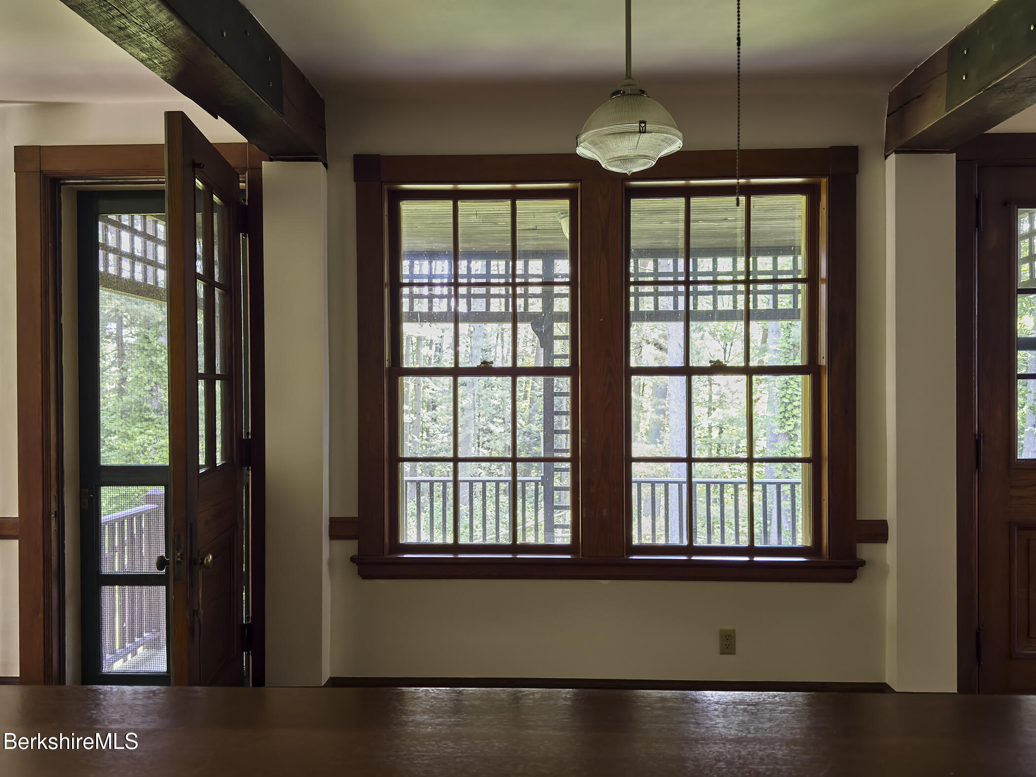 319 Under Mountain Road Lenox, MA 01240 - Photo 20 of 57 a view of an empty room with wooden floor and windows