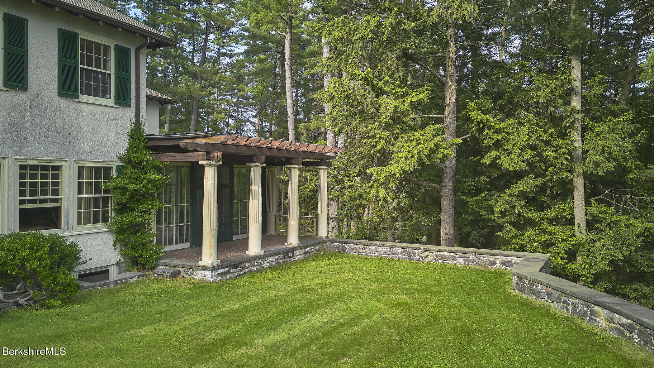 319 Under Mountain Road Lenox, MA 01240 - Photo 26 of 57 a view of a house with backyard and porch