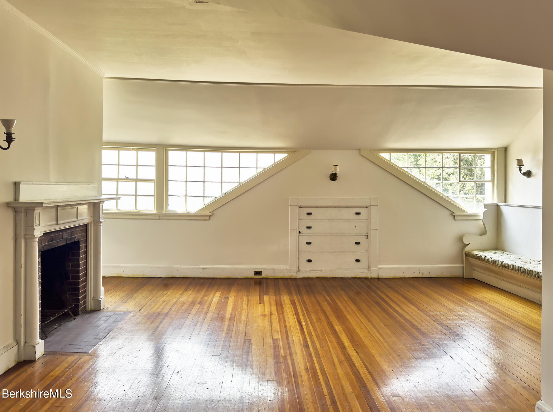 319 Under Mountain Road Lenox, MA 01240 - Photo 42 of 57 a view of an empty room with wooden floor and a window