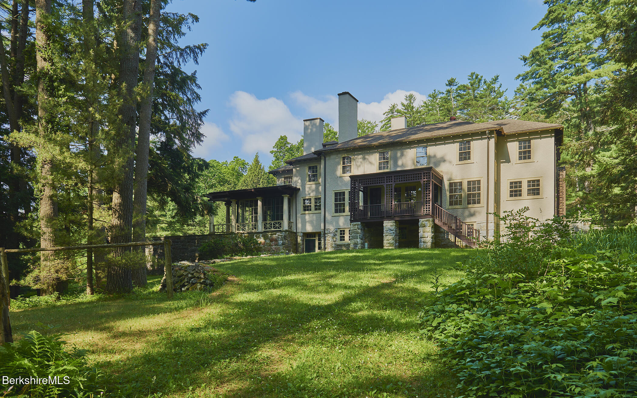 319 Under Mountain Road Lenox, MA 01240 - Photo 49 of 57 a front view of a house with a garden