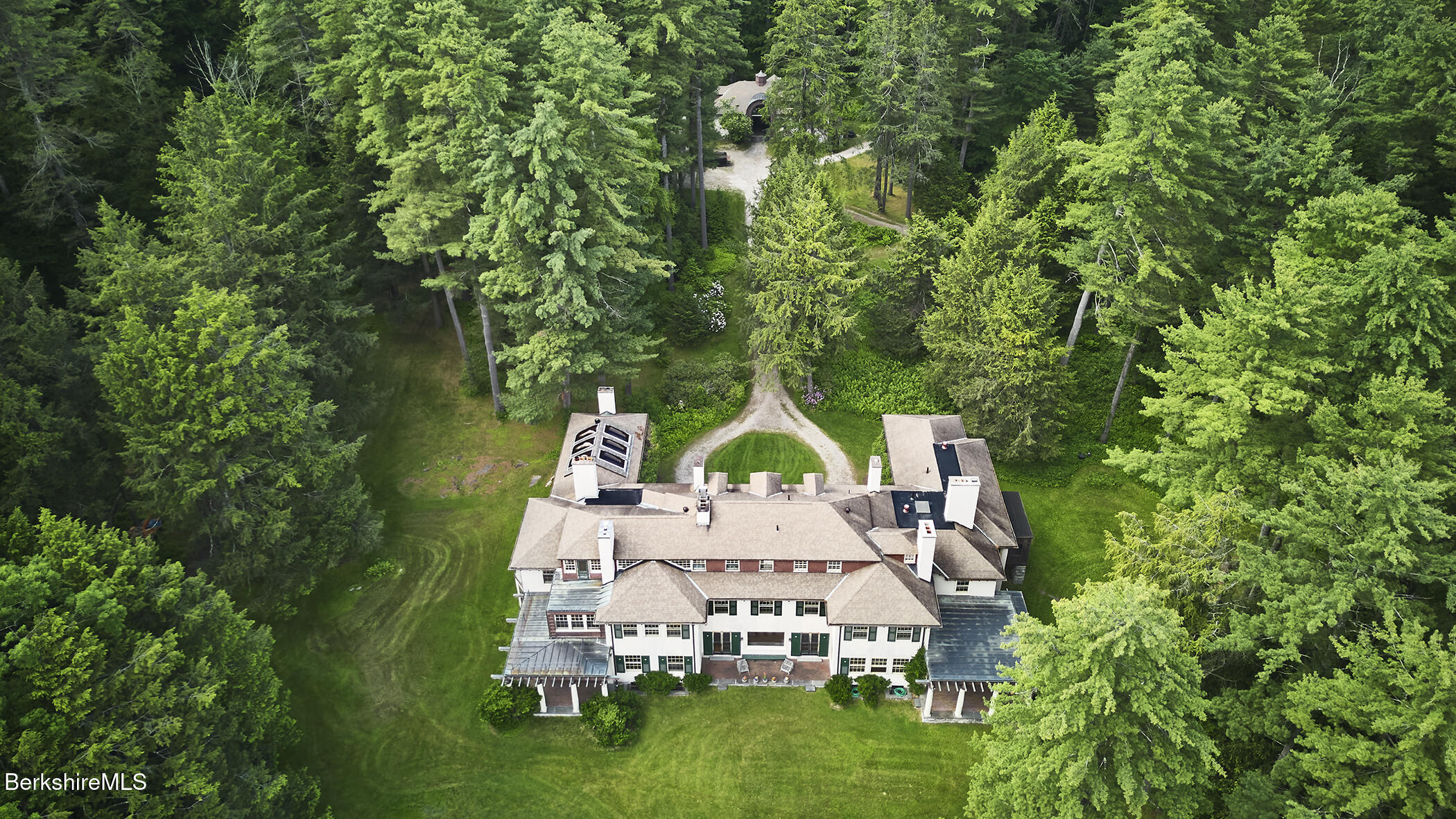319 Under Mountain Road Lenox, MA 01240 - Photo 55 of 57 a aerial view of a house with swimming pool and garden