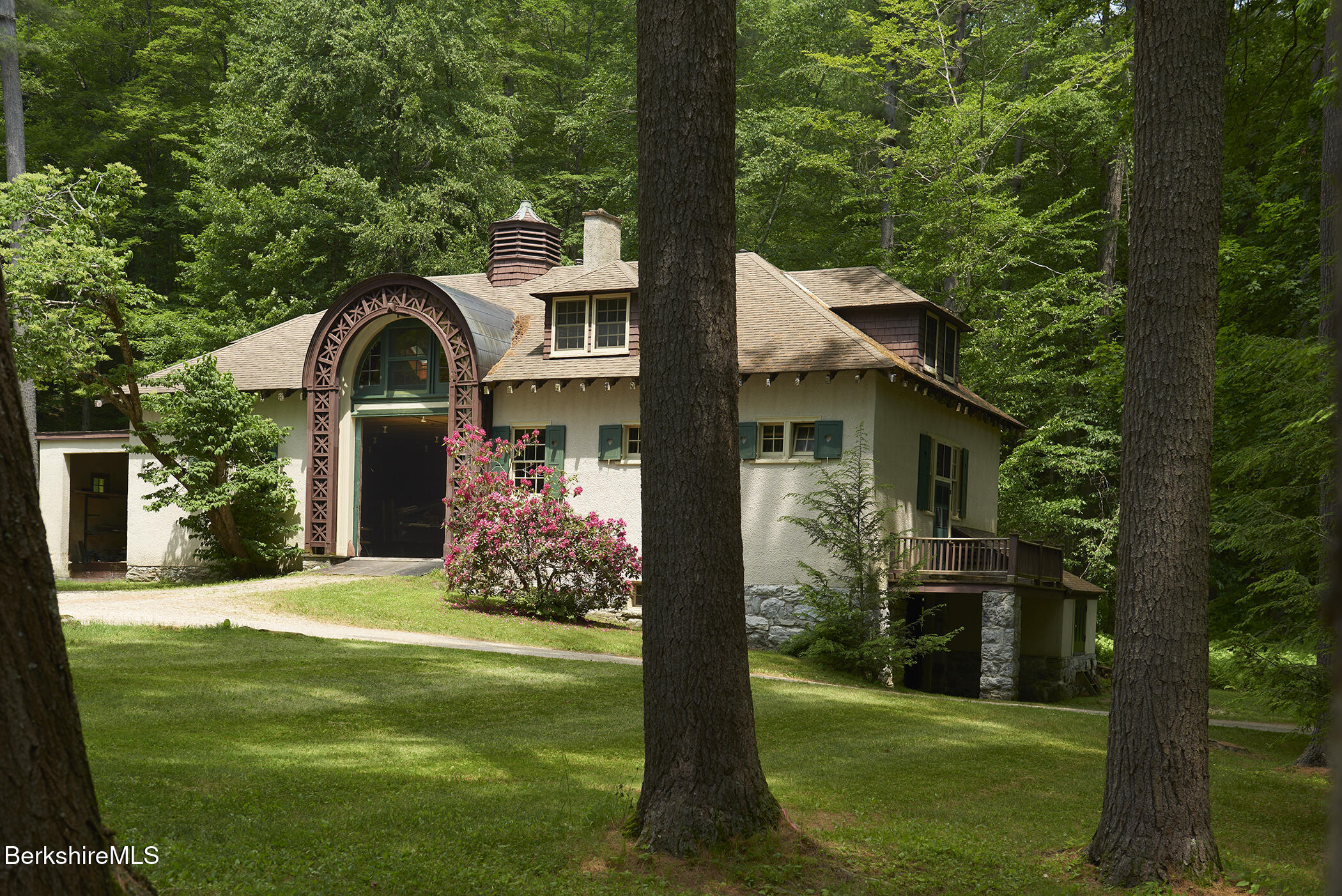 319 Under Mountain Road Lenox, MA 01240 - Photo 6 of 57 a front view of a house with garden