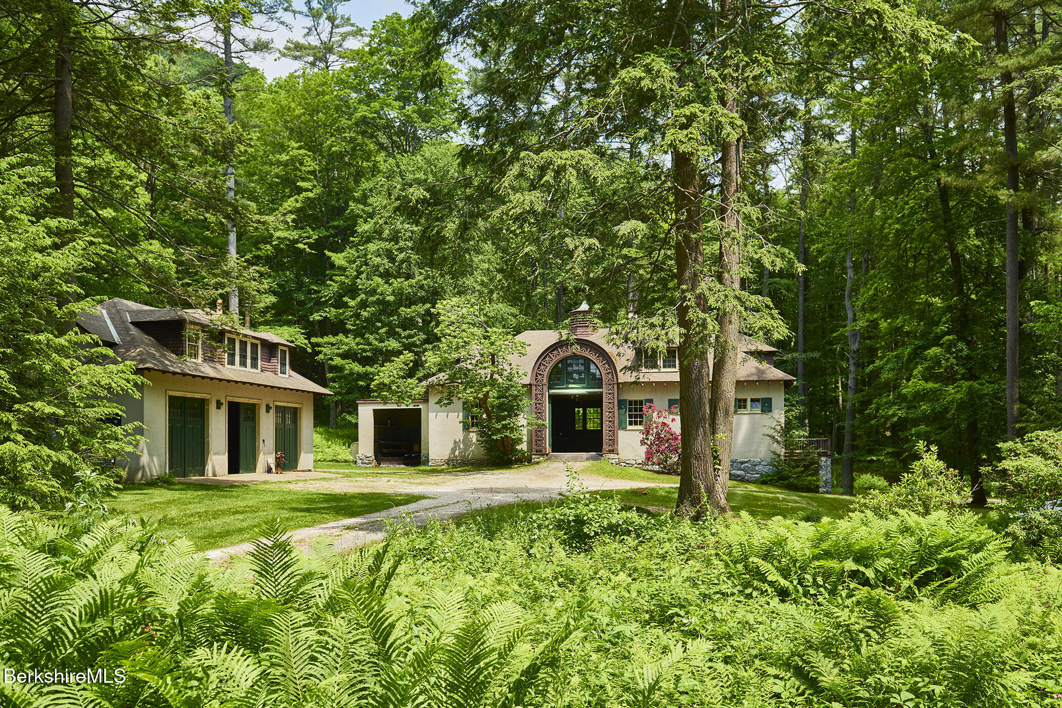 319 Under Mountain Road Lenox, MA 01240 - Photo 7 of 57 a front view of a house with a yard