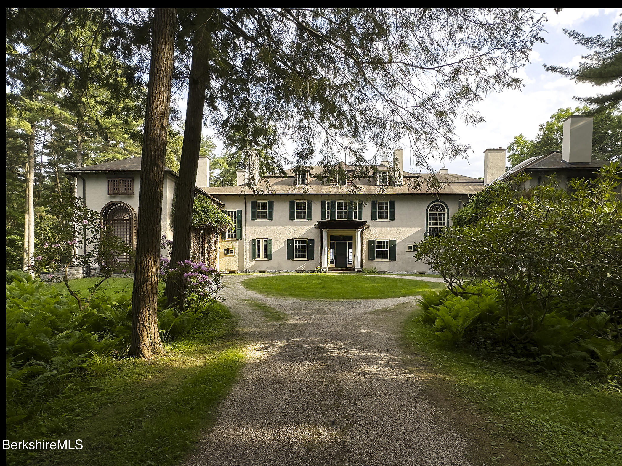 319 Under Mountain Road Lenox, MA 01240 - Photo 8 of 57 a front view of a house with a yard