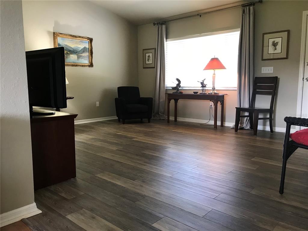 11879 Southwest 137th Loop Dunnellon, FL 34432 - Photo 7 of 37 a view of a livingroom with furniture and a flat screen tv