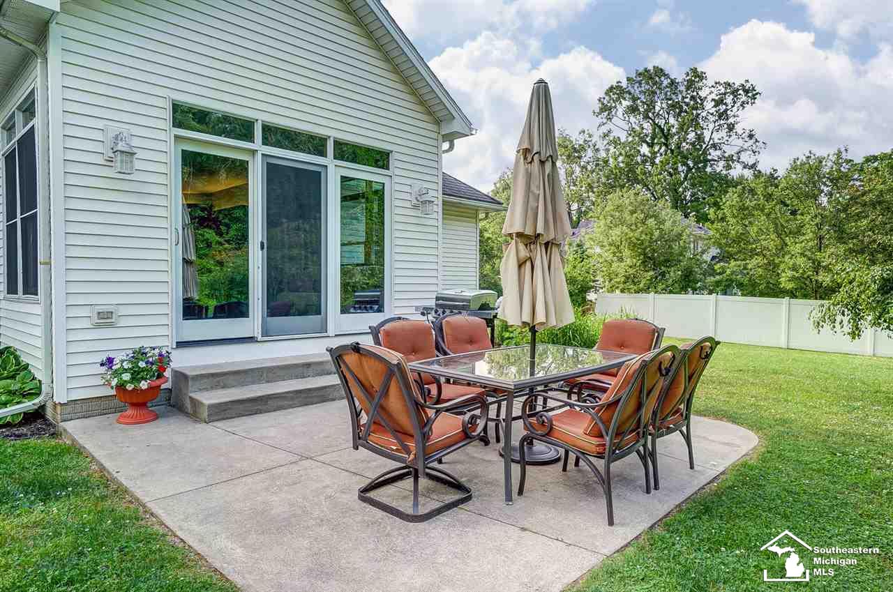 6475 Douglas Road Lambertville, MI 48144 - Photo 36 of 39 Concrete patio is outside sun room.