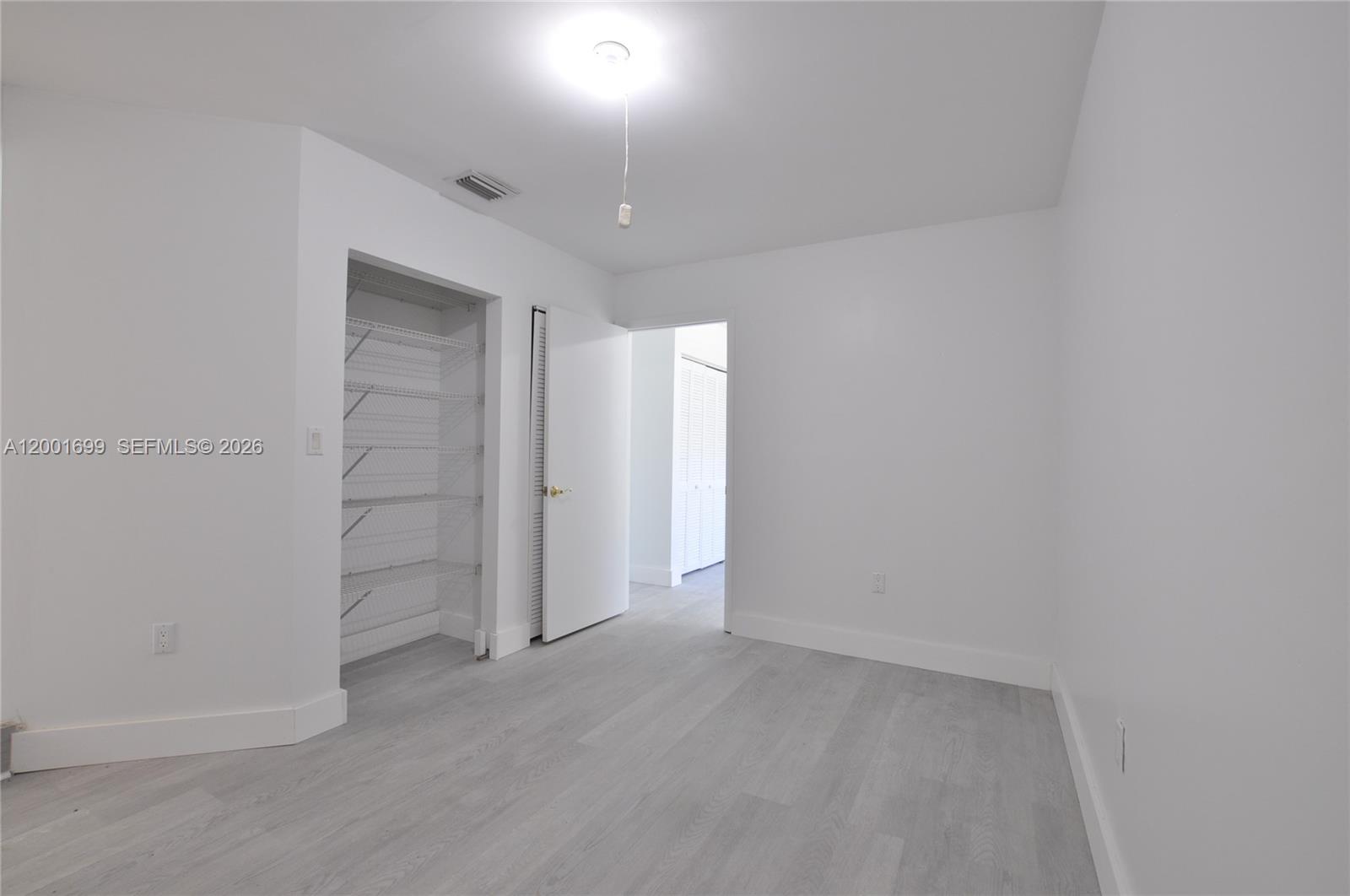 11111 Southwest 78th Court Pinecrest, FL 33156 - Photo 11 of 19 a view of an empty room