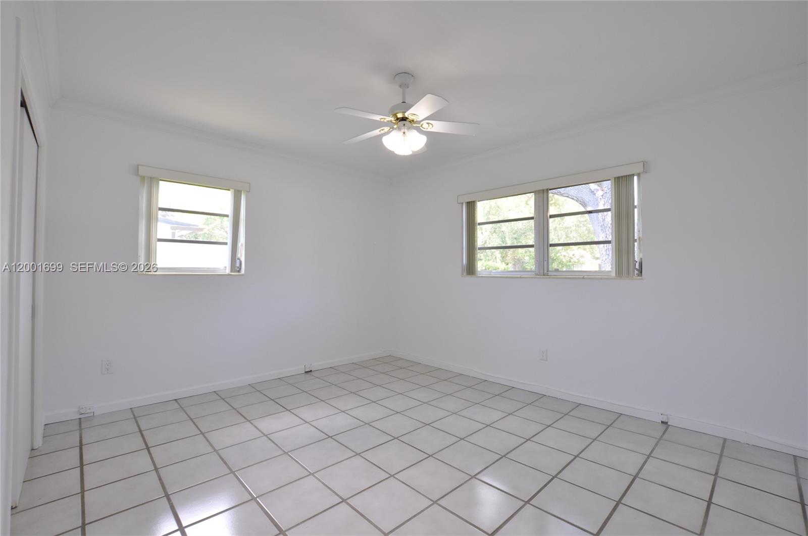 11111 Southwest 78th Court Pinecrest, FL 33156 - Photo 16 of 19 a view of an empty room with a window