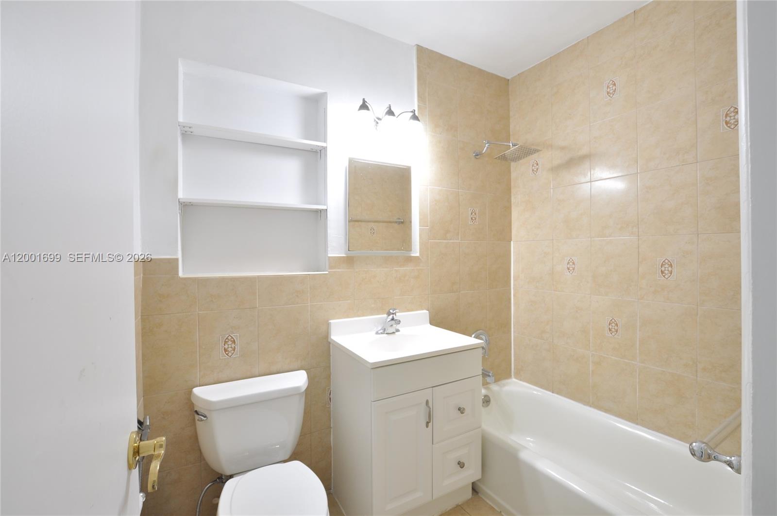 11111 Southwest 78th Court Pinecrest, FL 33156 - Photo 17 of 19 a bathroom with a sink toilet and shower