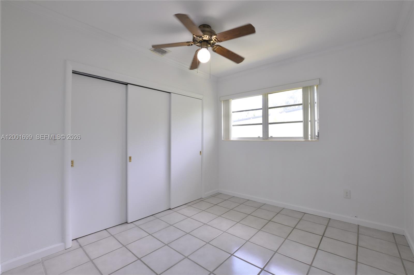 11111 Southwest 78th Court Pinecrest, FL 33156 - Photo 18 of 19 a view of an empty room with a window