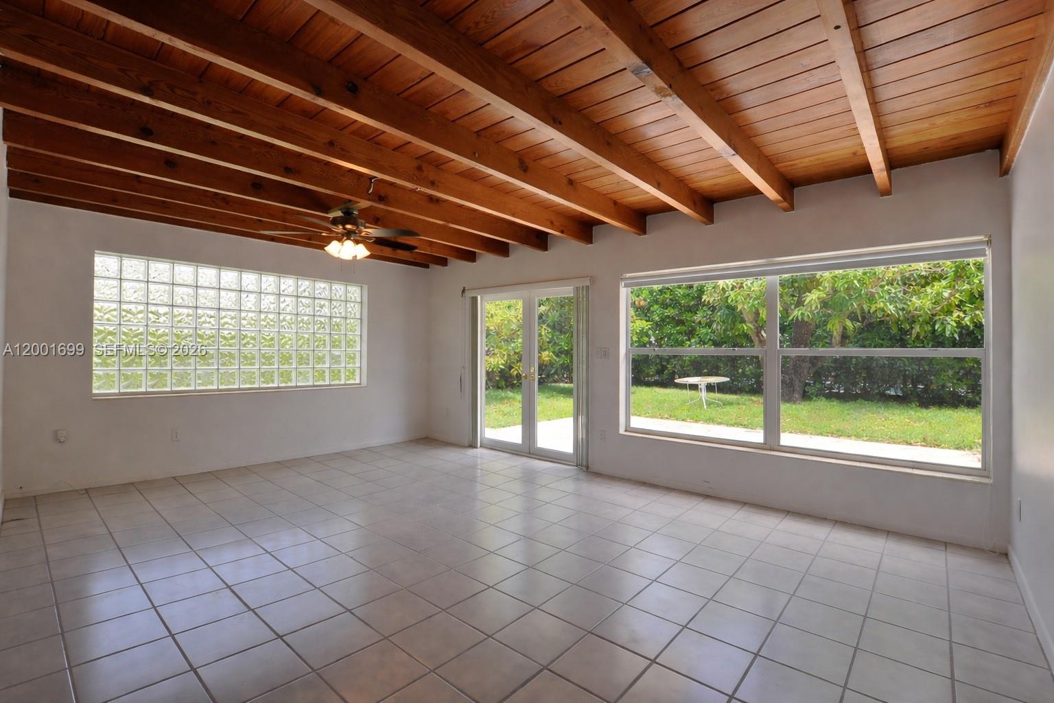 11111 Southwest 78th Court Pinecrest, FL 33156 - Photo 3 of 19 a view of an empty room with a window