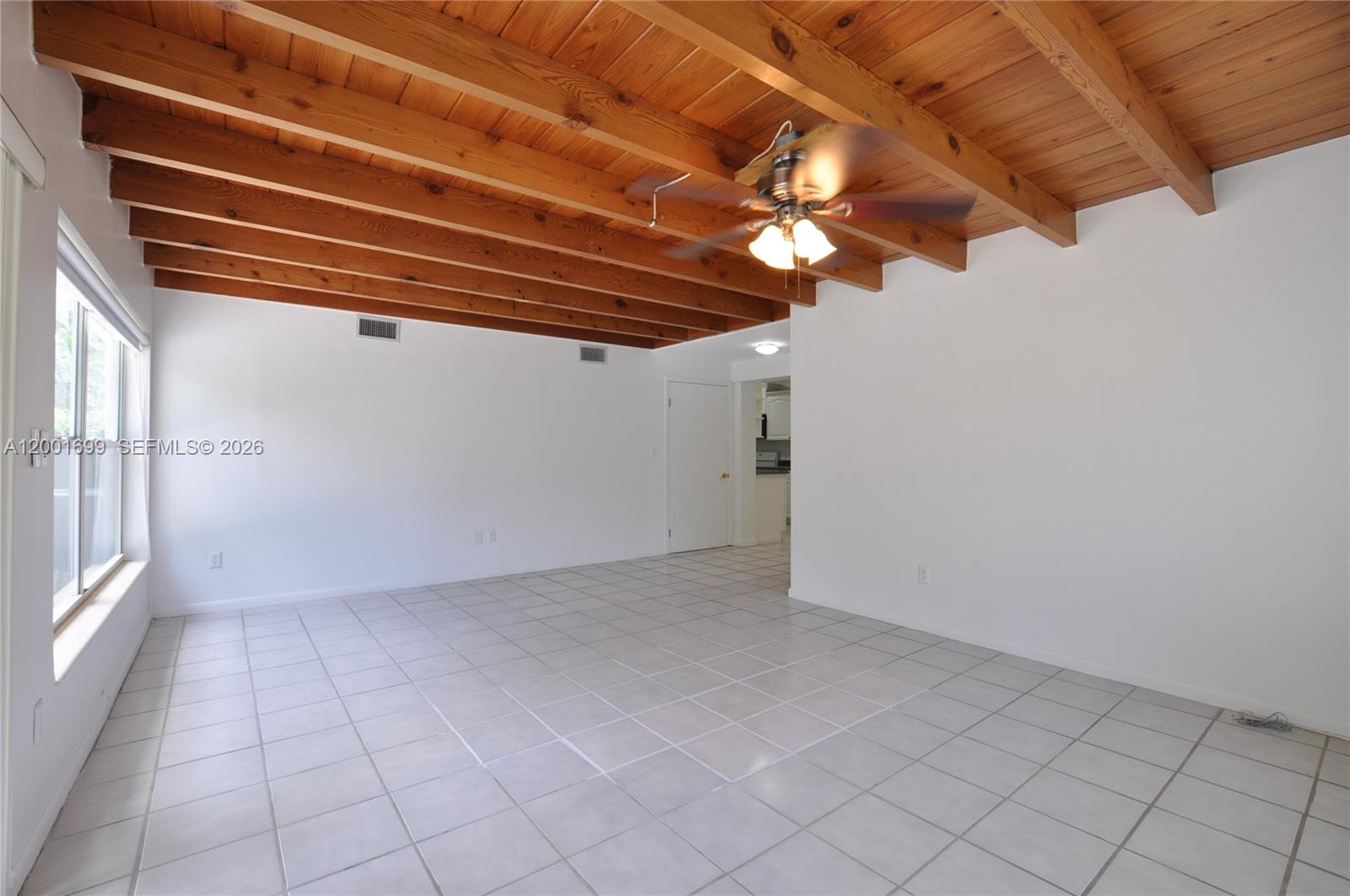 11111 Southwest 78th Court Pinecrest, FL 33156 - Photo 4 of 19 en empty room with windows