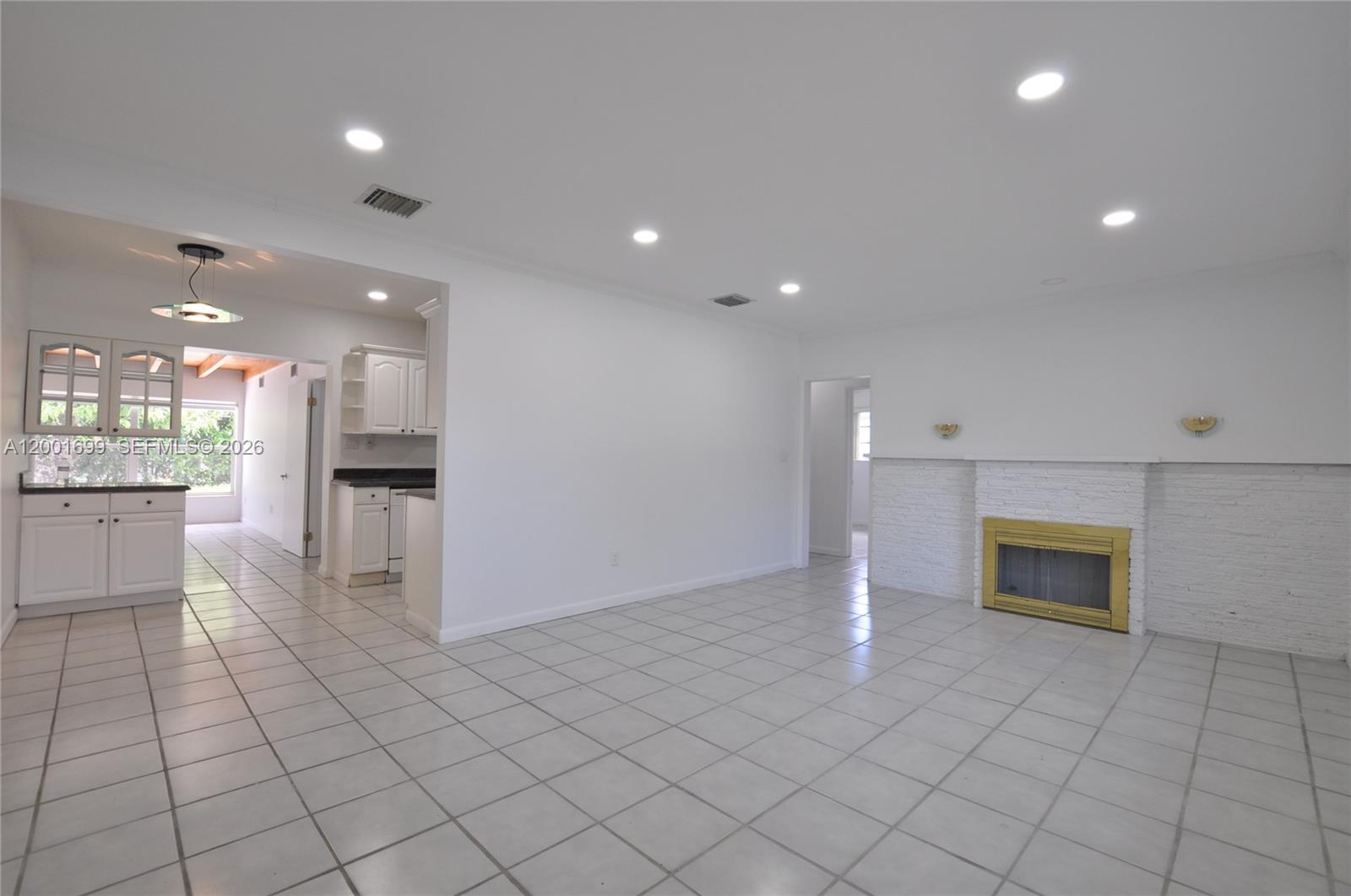 11111 Southwest 78th Court Pinecrest, FL 33156 - Photo 5 of 19 a view of a kitchen with white cabinets