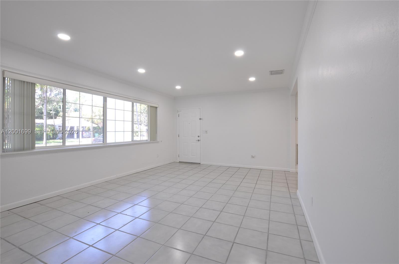 11111 Southwest 78th Court Pinecrest, FL 33156 - Photo 6 of 19 a view of an empty room with a window