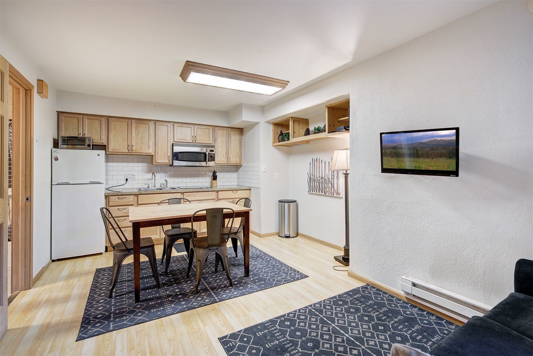 270 Primrose Path, Unit 33B Breckenridge, CO 80424 - Photo 5 of 21 a dining room with a table chairs and refrigerator