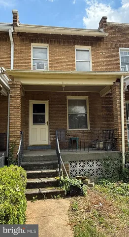 a front view of a house with stairs