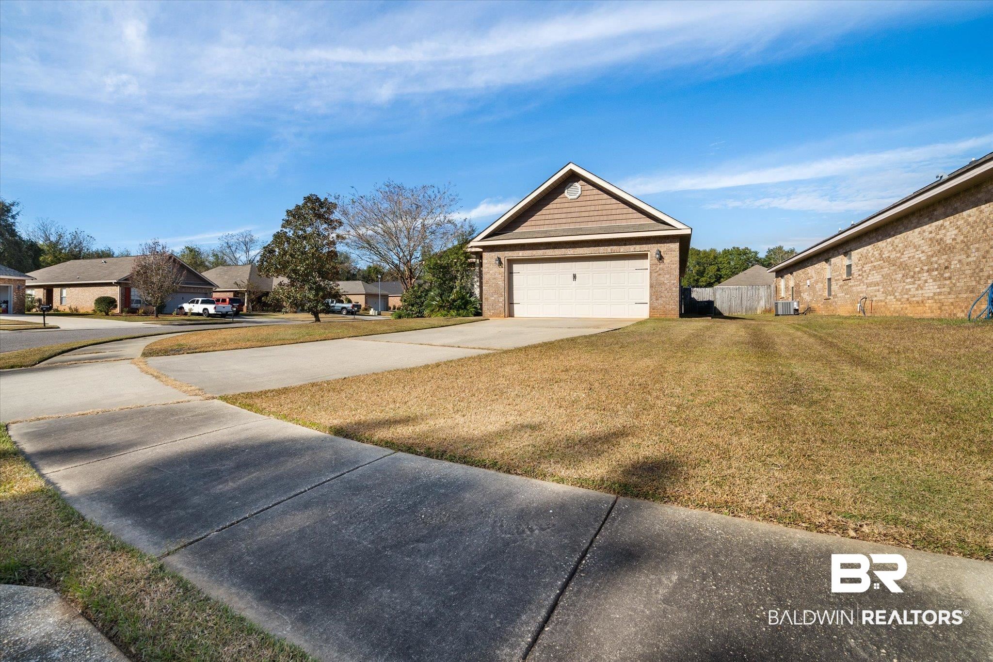 10251 Fionn Loop Daphne, AL 36526 - Photo 26 of 28 Exterior space featuring a garage