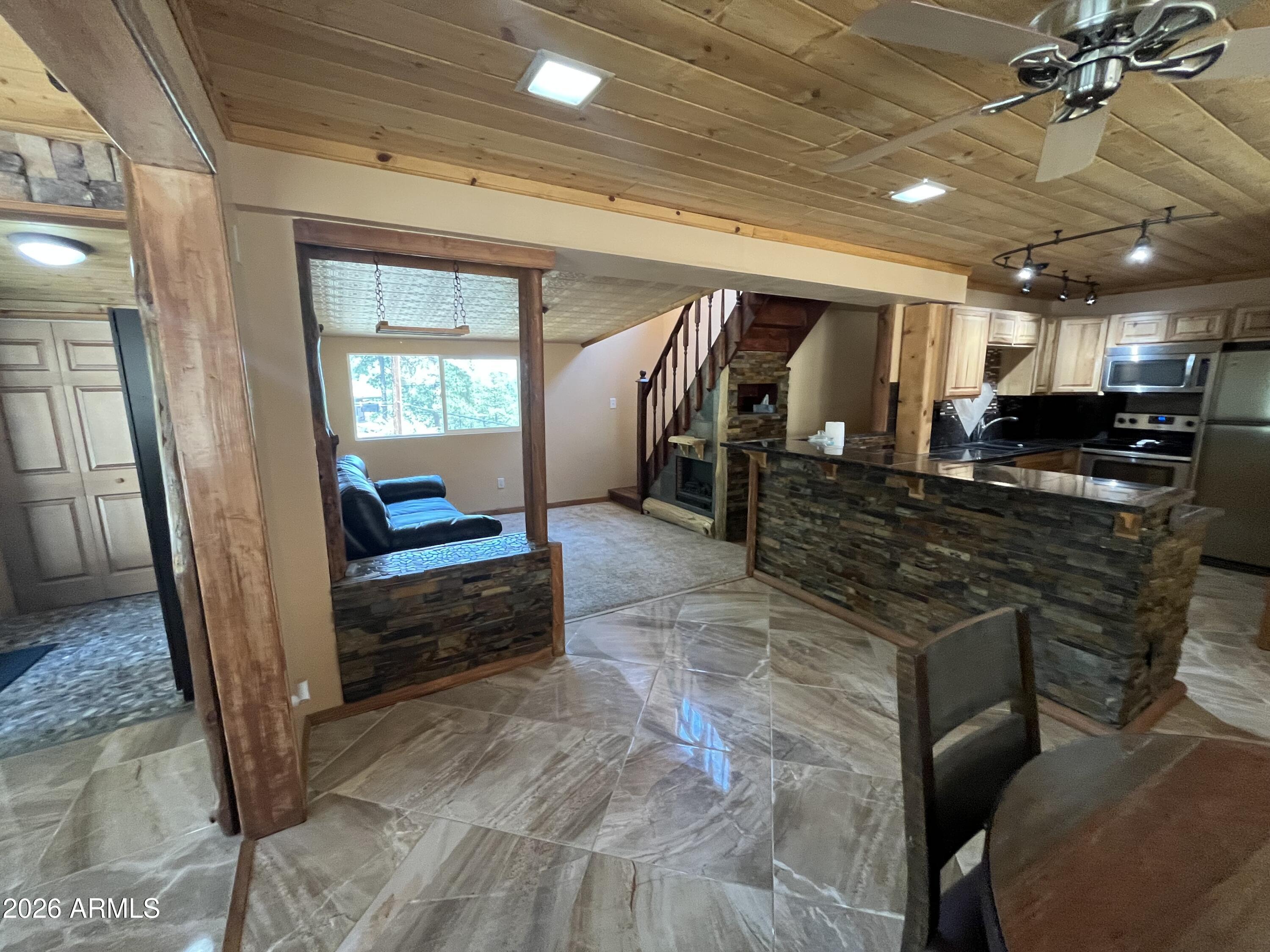 23338 Sunny South Road Crown King, AZ 86343 - Photo 15 of 32 a lobby with furniture and a rug