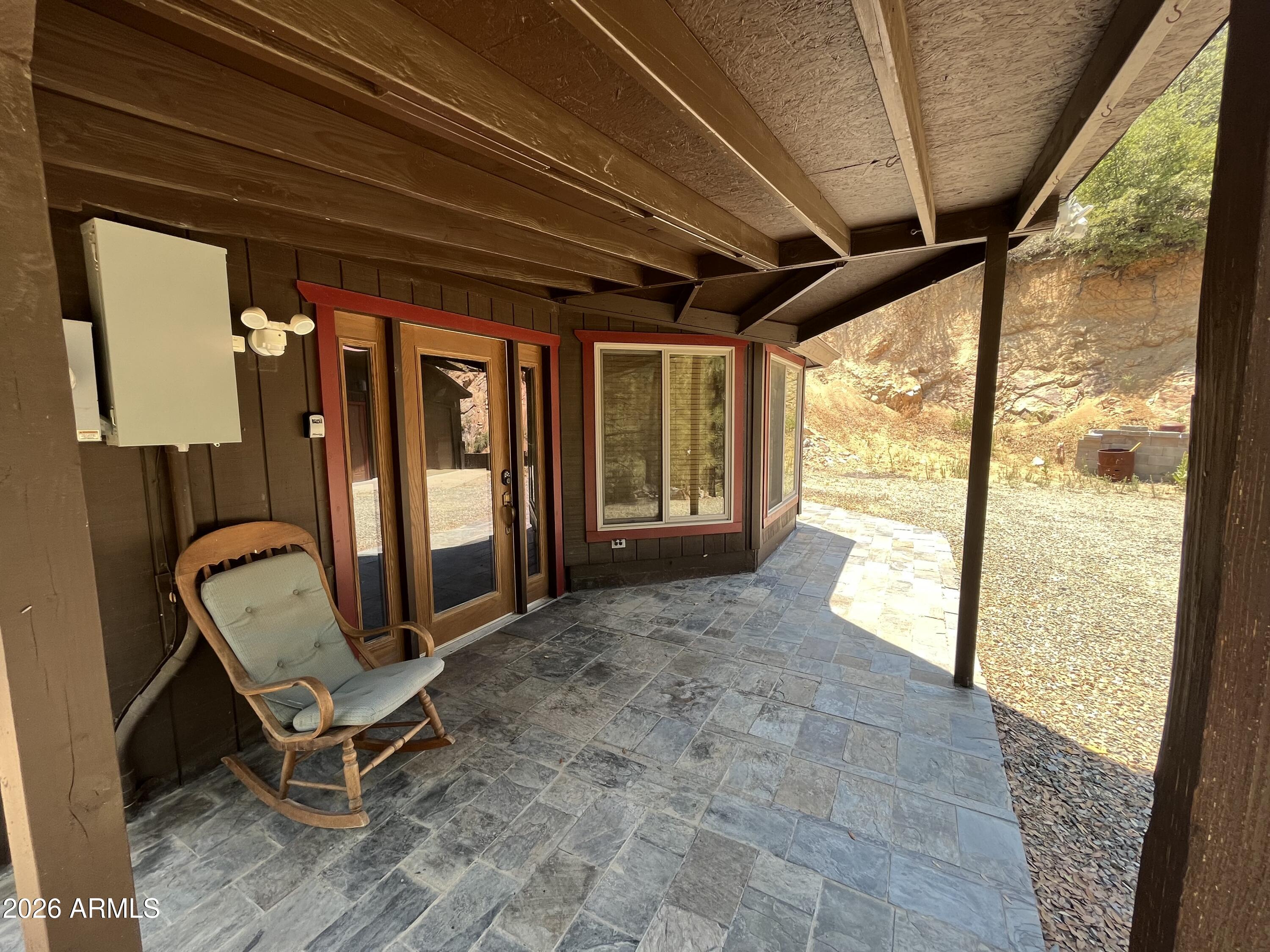 23338 Sunny South Road Crown King, AZ 86343 - Photo 3 of 32 a view of a room with chairs and large windows