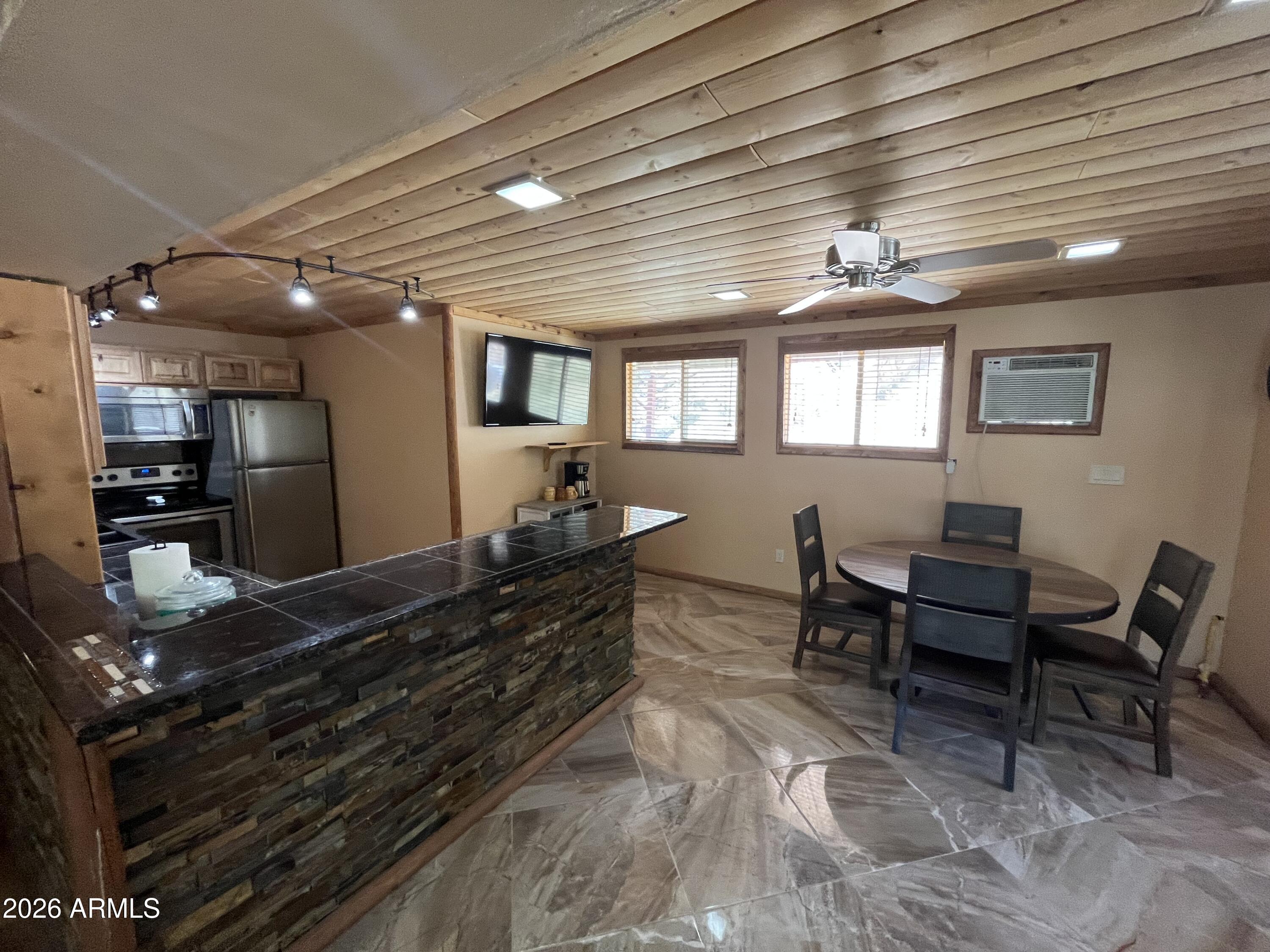 23338 Sunny South Road Crown King, AZ 86343 - Photo 6 of 32 a living room with furniture and a large window