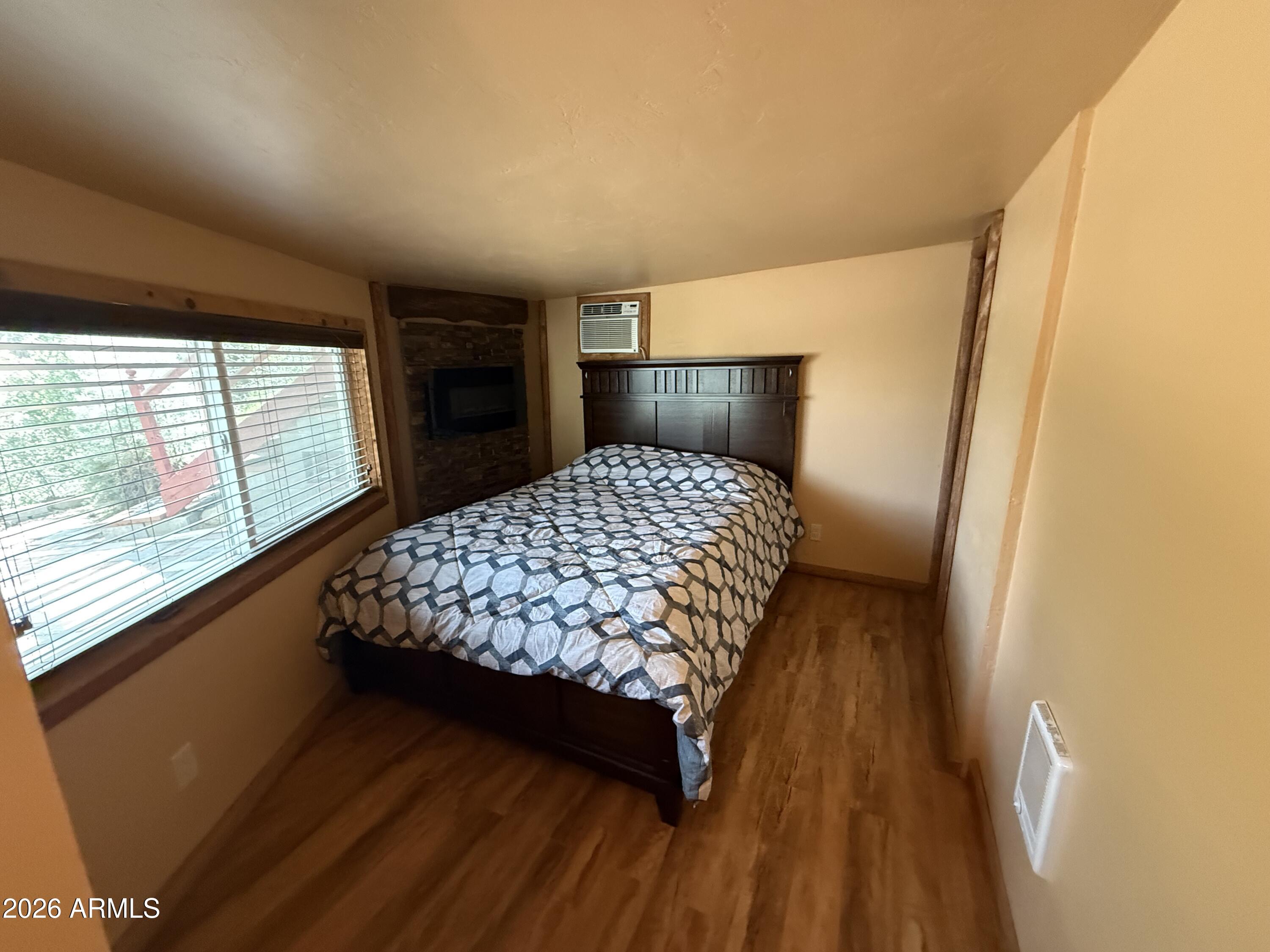 23338 Sunny South Road Crown King, AZ 86343 - Photo 7 of 32 a bedroom with a bed and window