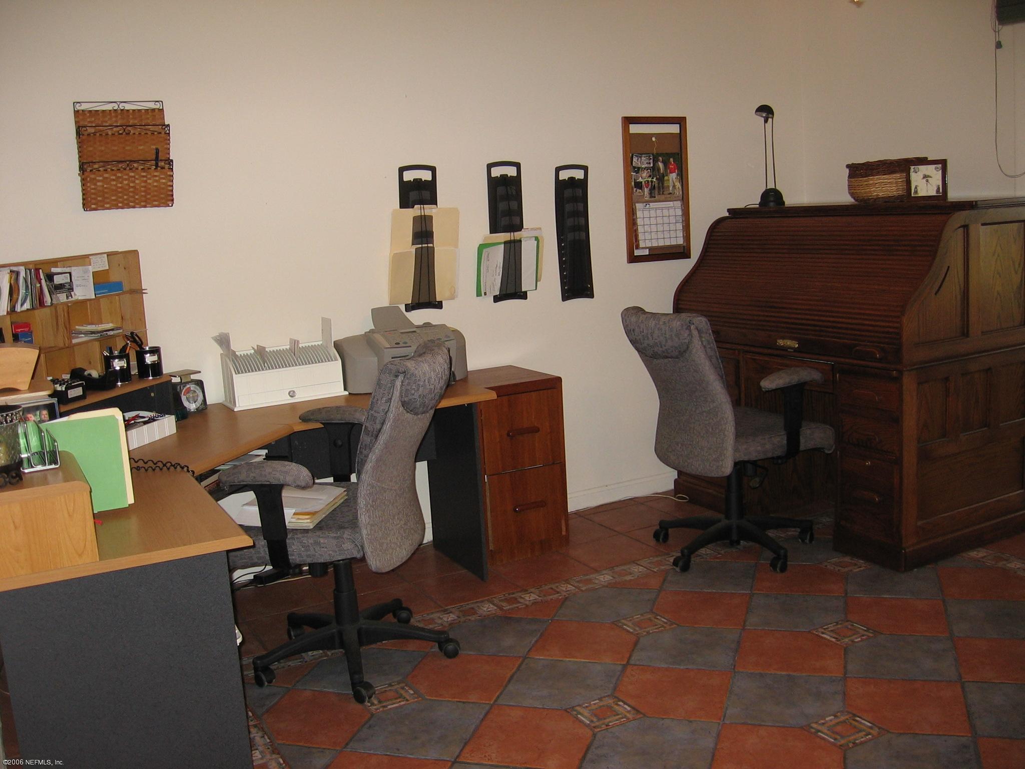 2728 Holly Point Road East Orange Park, FL 32073 - Photo 15 of 15 a view of a workspace with furniture and a window