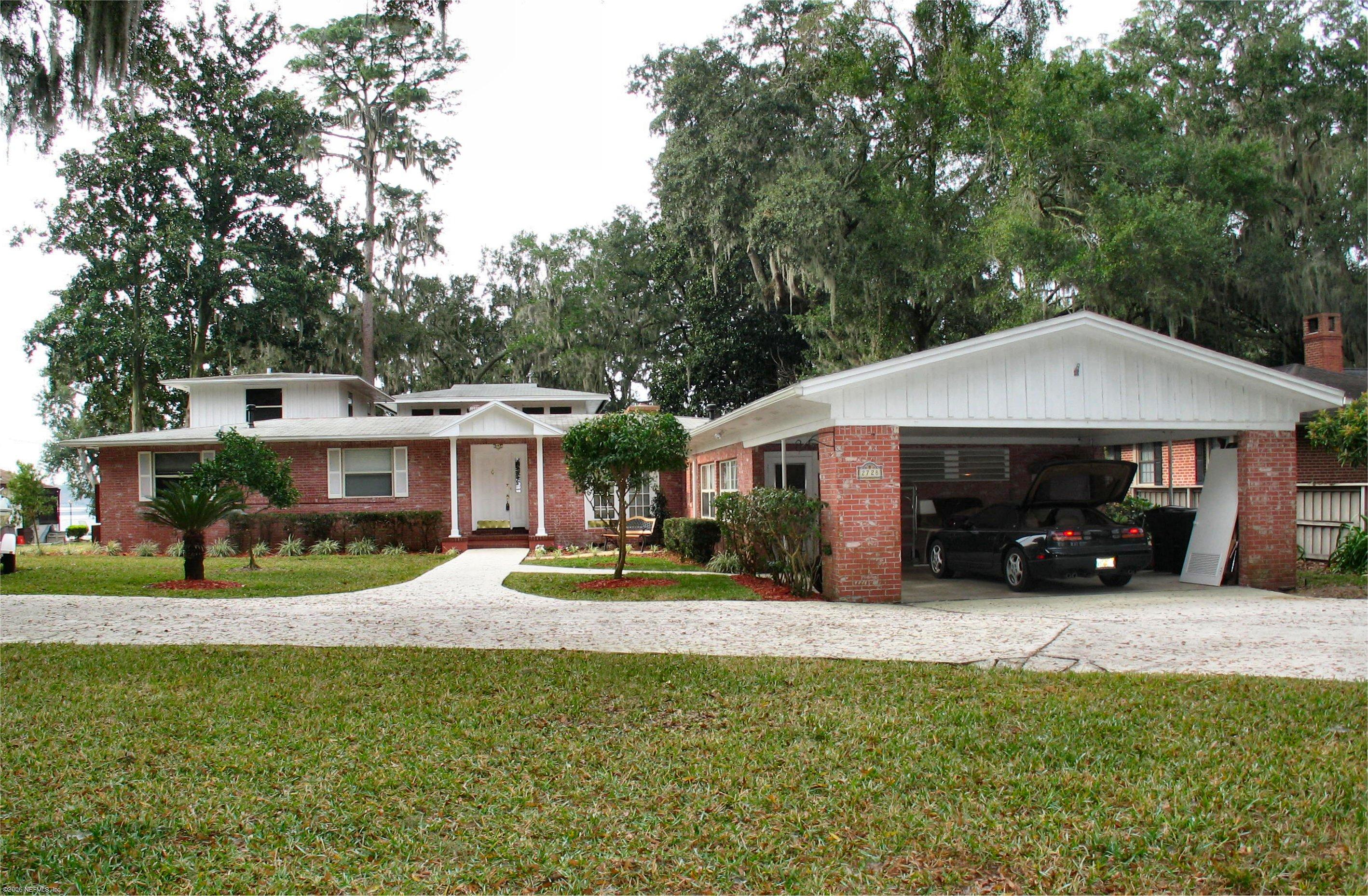 2728 Holly Point Road East Orange Park, FL 32073 - Photo 5 of 15 a view of a house with a yard patio and fire pit