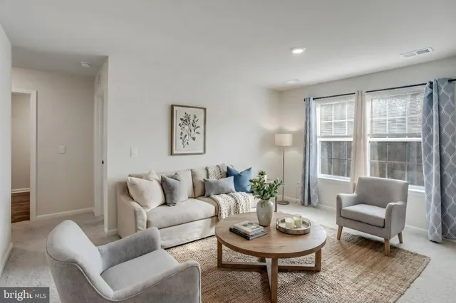 a view of a backyard with a large tree