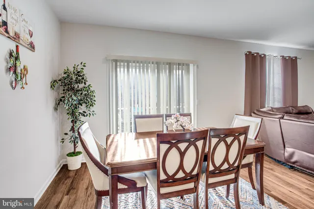 a view of a dining room with furniture and window