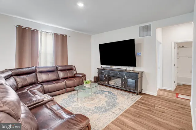 a living room with furniture and a couch