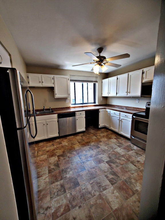 8 Ashland Street, Unit 1L Worcester, MA 01609 - Photo 11 of 27 a view of a refrigerator in kitchen and a window