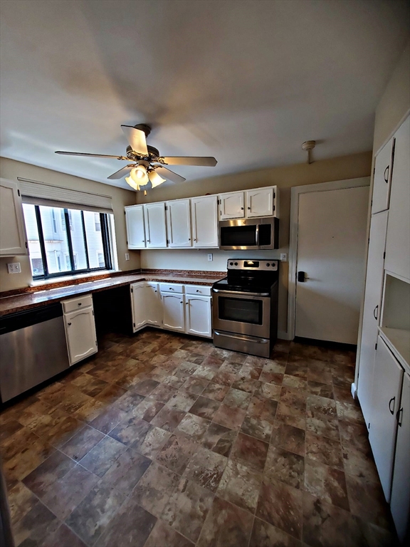 8 Ashland Street, Unit 1L Worcester, MA 01609 - Photo 12 of 27 a view of a kitchen with a sink and stainless steel appliances