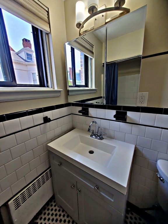 8 Ashland Street, Unit 1L Worcester, MA 01609 - Photo 19 of 27 a bathroom with a sink and a mirror