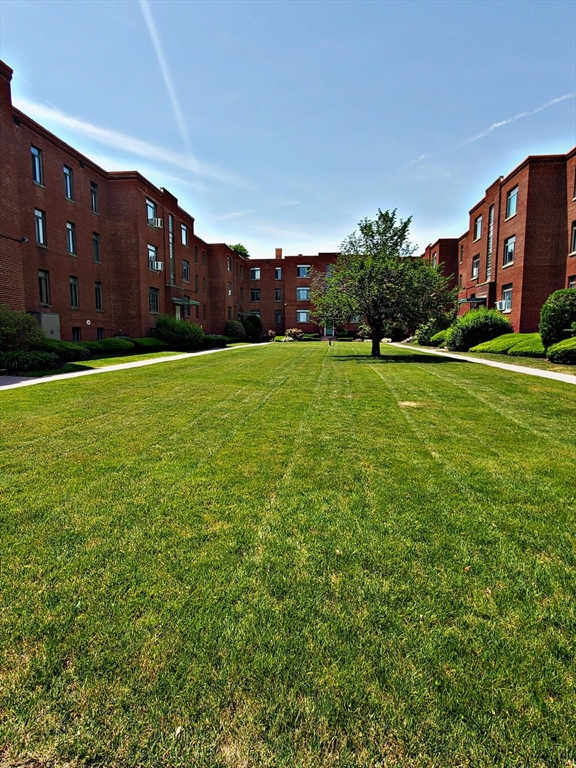 8 Ashland Street, Unit 1L Worcester, MA 01609 - Photo 2 of 27 a view of a house with a big yard