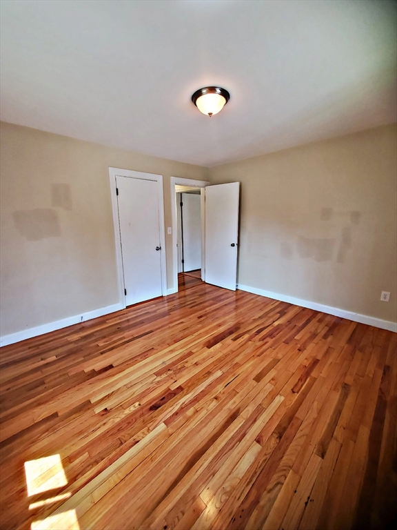 8 Ashland Street, Unit 1L Worcester, MA 01609 - Photo 23 of 27 a view of empty room with wooden floor