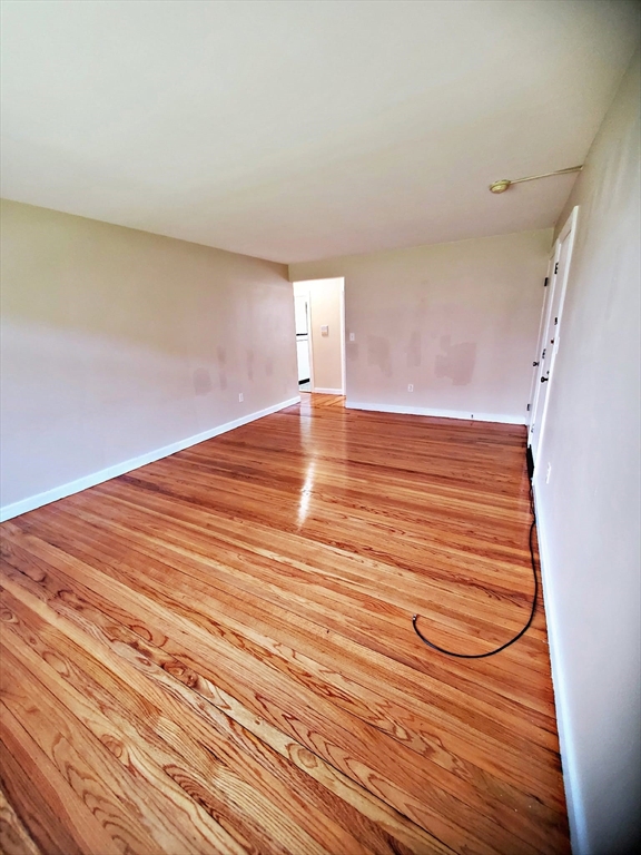 8 Ashland Street, Unit 1L Worcester, MA 01609 - Photo 7 of 27 a view of a room with wooden floor